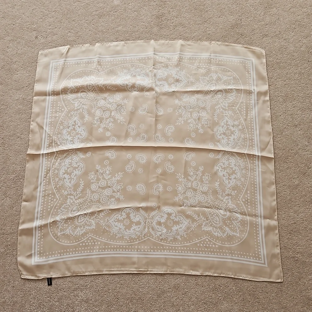 Tan and white scarf, $20
